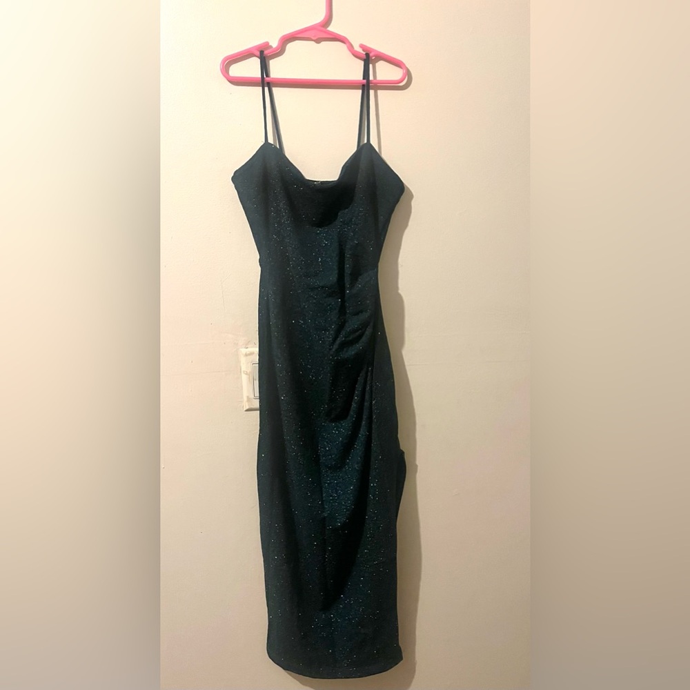 Emerald green dress with sparkles and a leg slip